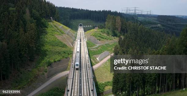 Picture taken on May 26, 2018 shows an ICE high speed train of German Deutsche Bahn driving on the new high-speed railway line between Nuremberg and...