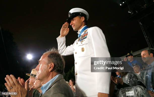 Naval officer salutes during the Salute to the Services with the Joint Chiefs of Staff and the National Guard Bureau at the 2018 National Memorial...