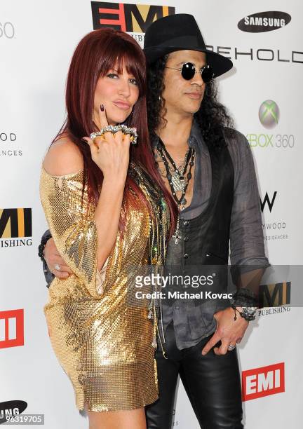 Musician Slash and wife Perla Hudson arrive at the EMI Post-GRAMMY Party at W Hollywood on January 31, 2010 in Hollywood, California.