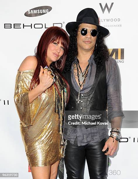 Musician Slash and wife Perla Hudson arrive at the EMI Post-GRAMMY Party at W Hollywood on January 31, 2010 in Hollywood, California.