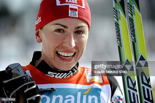 Pole Justyna Kowalczyk celebrates her victory in the women's 10km freestyle FIS nordic ski World Cup in Lahti on March 8, 2009. Kowalczyk won ahead...