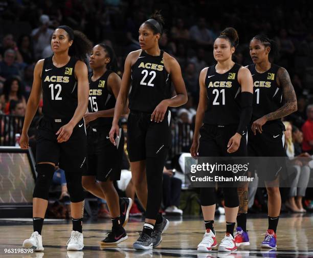Nia Coffey, Lindsay Allen, A'ja Wilson, Kayla McBride and Tamera Young of the Las Vegas Aces walk on the court after a timeout during the Aces'...