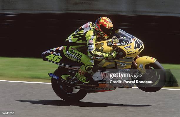 Nastro Azzurro Honda rider Valentino Rossi of Italy celebrates with a wheelie after finishing in 3rd place at the 500cc Motorcycle Grand Prix at the...