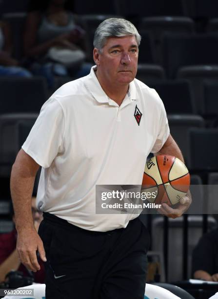 Head coach Bill Laimbeer of the Las Vegas Aces watches his team warm up before the Aces' inaugural regular-season home opener against the Seattle...