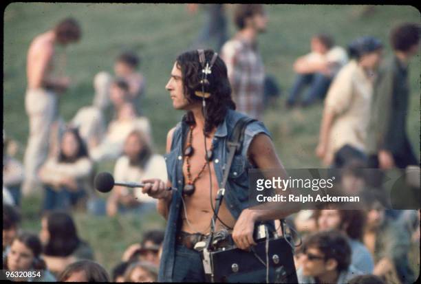 Sound Guy with mic and Nagra near Free Stage, at the Woodstock music festival, August 1969.