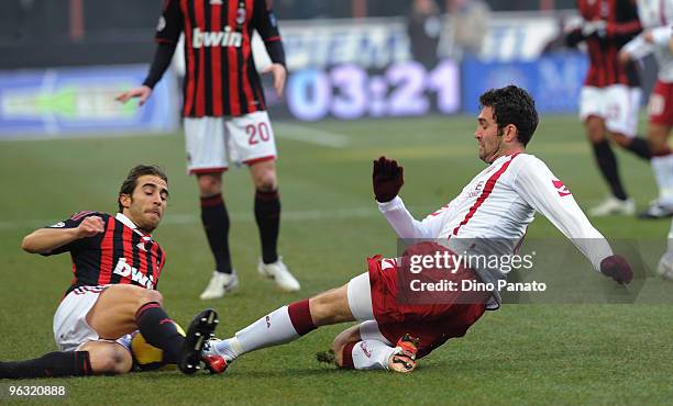 Mathieu Flamini of Milan battles for the ball with Dario Knezevic of Livorno during the Serie A match between AC Milan and Livorno at Stadio Giuseppe...