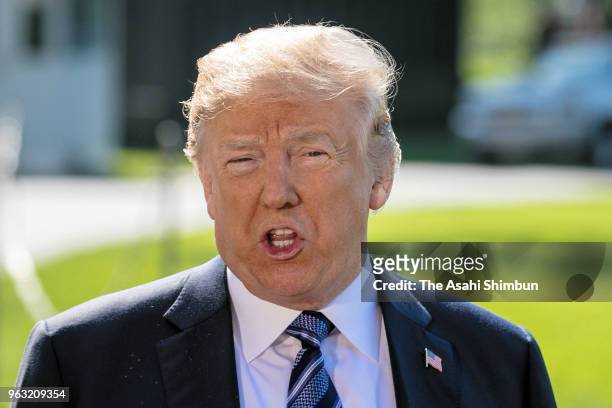 President Donald Trump talks to members of the news media before departing the White House on May 25, 2018 in Washington, DC. Trump is traveling to...