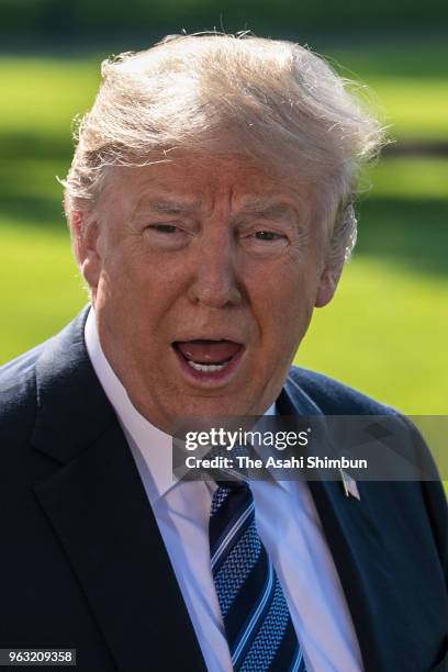 President Donald Trump talks to members of the news media before departing the White House on May 25, 2018 in Washington, DC. Trump is traveling to...