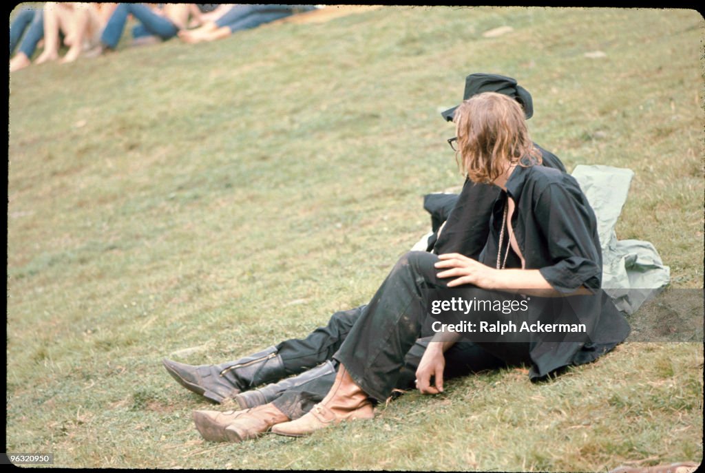 Two people in black on the hillside