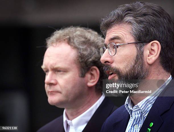 Irish Republican politician Gerry Adams and the Sinn Fein delegation speak to the press on their way into the talks at Stormont, 1st July 1999. On...