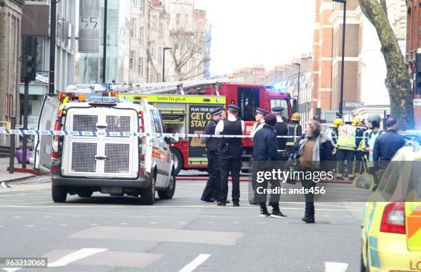 police officers and vehicles in london street - london police stock pictures, royalty-free photos & images