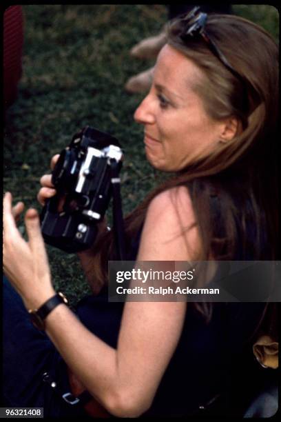 Female photographer at Woodstock, August 1969.