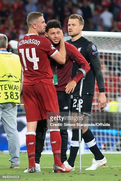 Jordan Henderson of Liverpool consoles injured teammate Alex Oxlade-Chamberlain of Liverpool who is on crutches after the UEFA Champions League Final...