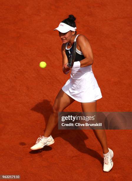 Veronica Cepede Royg of Paraguay plays a backhand during the ladies singles first round match aganist Petra Kvitova of Czech Republic during day two...