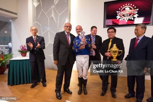 Jockey Glen Boss, trainer Stephen Gray, and owner celebrate after Lim's Cruiser winning Race 7 Lion City Cup at Kranji Race course on May 26 ,2018 in...