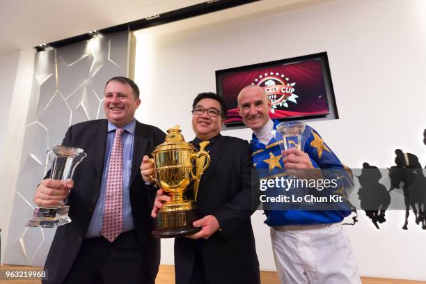 Jockey Glen Boss, trainer Stephen Gray, and owner celebrate after Lim's Cruiser winning Race 7 Lion City Cup at Kranji Race course on May 26 ,2018 in...