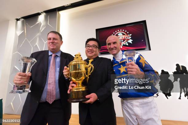 Jockey Glen Boss, trainer Stephen Gray, and owner celebrate after Lim's Cruiser winning Race 7 Lion City Cup at Kranji Race course on May 26 ,2018 in...