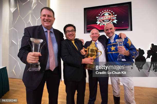 Jockey Glen Boss, trainer Stephen Gray, and owner celebrate after Lim's Cruiser winning Race 7 Lion City Cup at Kranji Race course on May 26 ,2018 in...