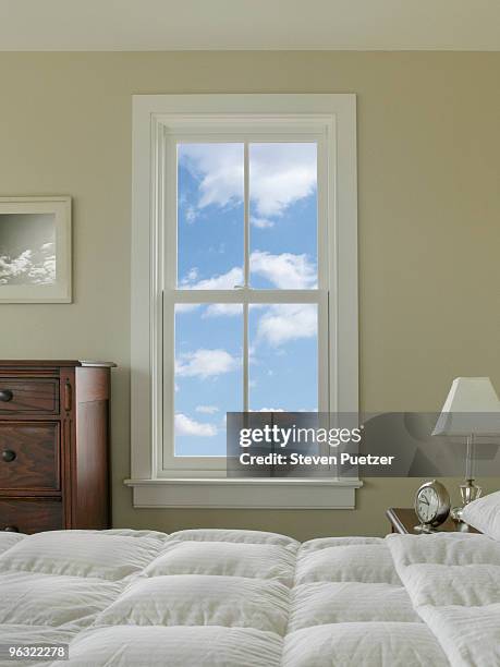 view out bedroom window with blue sky and clouds - marco de ventana fotografías e imágenes de stock