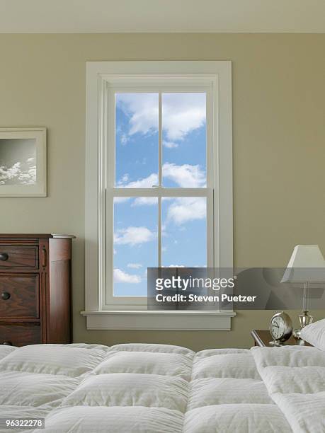 view out bedroom window with blue sky and clouds - windows stock pictures, royalty-free photos & images