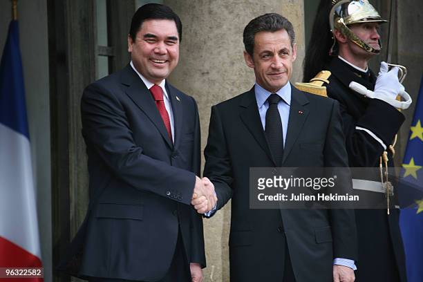 French President Nicolas Sarkozy shakes hands with his Turkmen counterpart Gurbanguly Berdymukhamedov prior to a working lunch on February 1, 2010 at...