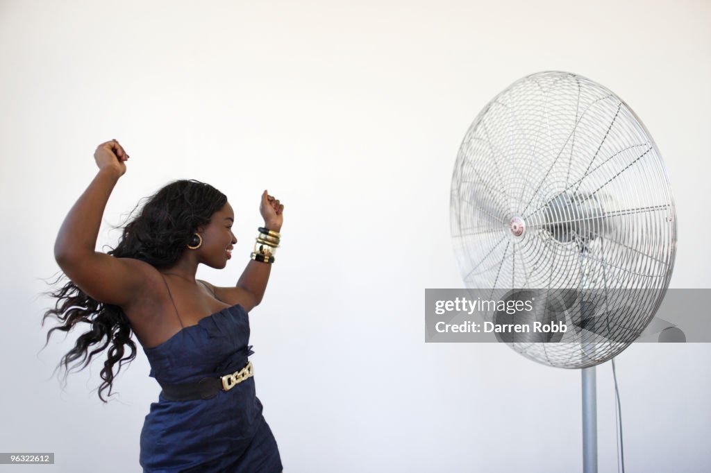 Silly Dance Using Fans Young Woman Dancing By Giant Cooling Fan High-Res Stock Photo - Getty ...