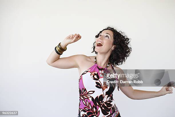 young woman dancing and laughing - skaka på huvudet bildbanksfoton och bilder