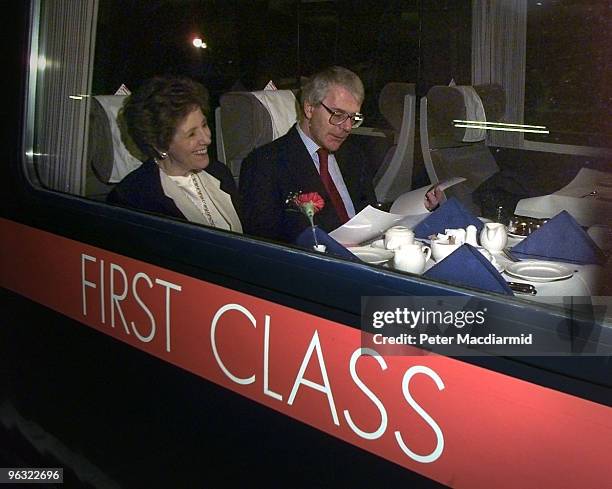 British Prime Minister John Major and his wife Norma on a train at King's Cross Station, London, bound for Teeside, 21st February 1997.