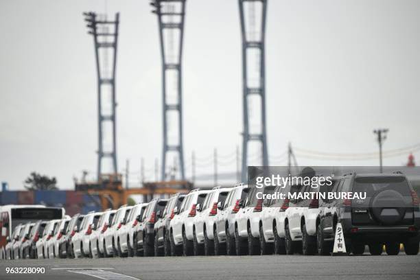 Toyota Land Cruiser Prado vehicles are seen parked at the Daikoku pier in Yokohama, Kanagawa prefecture on May 28, 2018.