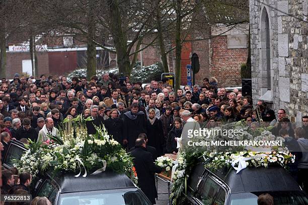 Mourners gather during the funeral ceremony of Charlotte Francois and Pierre Guilliams, victims of last Wednesday's gas explosion that destroyed a...