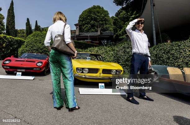 Visitor reviews a 1967 Iso Grifo GL 350 autombile, center, at the 2018 Concorso D'Eleganza at Villa d'Este in Cernobbio, Italy, on Saturday, May 26,...
