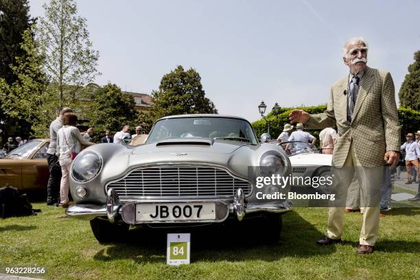 Aston Martin Lagonda Ltd. DB5 automobile carrying the number plate "JB007" stands on display at the 2018 Concorso D'Eleganza at Villa d'Este in...