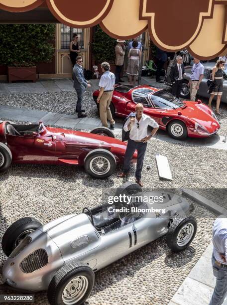 Porsche AG 718/2, bottom, a 1954 Maserati SpA 250F, left, and winner of the Coppa d'Oro Villa d'Este, a 1968 Alfa Romeo Automobiles SpA 33/2...