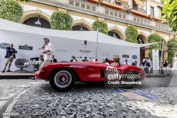 Entrant Jose M. Fernandez drives a 1955 Ferrari NV 750 Monza automobile past guests at the 2018 Concorso D'Eleganza at Villa d'Este in Cernobbio,...