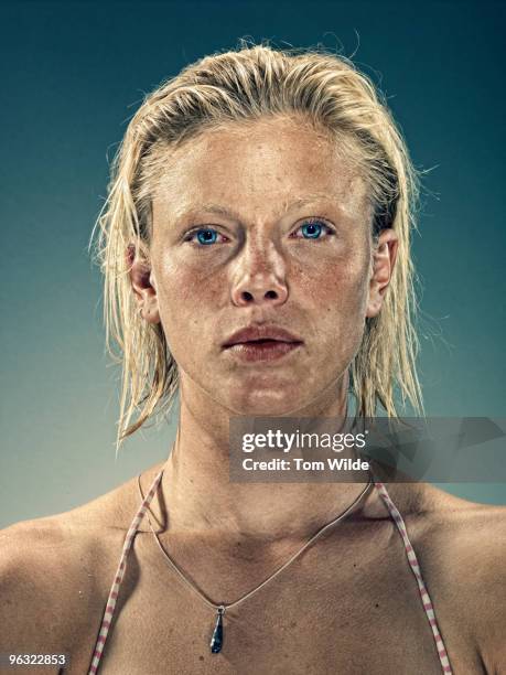 young blonde woman staring intently into camera - slicked back hair stock pictures, royalty-free photos & images
