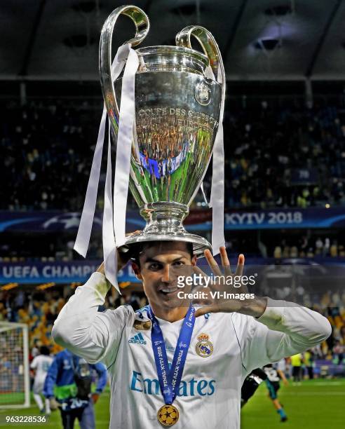 Cristiano Ronaldo of Real Madrid CF celebrating his fifth Champions League trophy during the UEFA Champions League final between Real Madrid and...