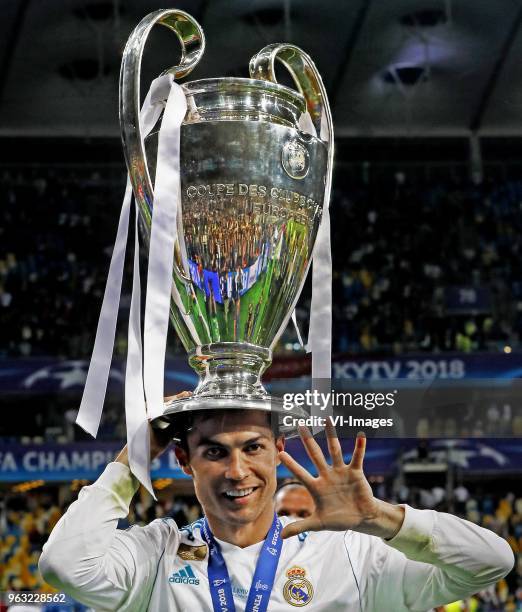 Cristiano Ronaldo of Real Madrid CF celebrating his fifth Champions League trophy during the UEFA Champions League final between Real Madrid and...