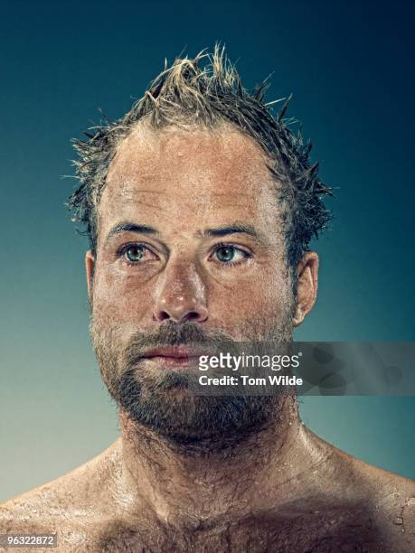 portrait of a young man with beard and wet hair  - nasses haar stock-fotos und bilder