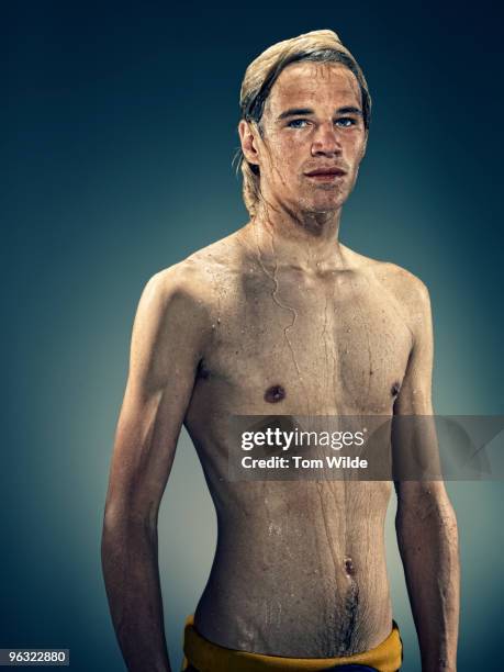 young male surfer with wet hair and torso - slim man stock pictures, royalty-free photos & images