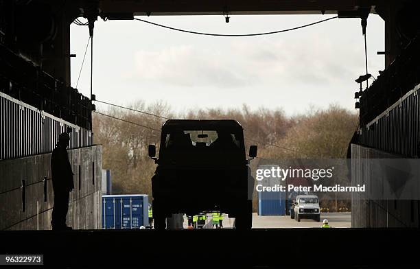 Red Cross Land Rovers are loaded on to the Royal Fleet Auxiliary supply ship RFA Largs Bay on February 1, 2010 in Southampton, England. Taking 12...