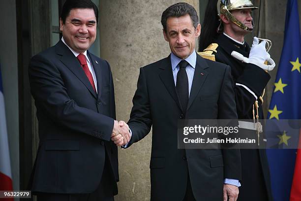 French President Nicolas Sarkozy shakes hands with his Turkmen counterpart Gurbanguly Berdymukhamedov prior to a working lunch on February 1, 2010 at...