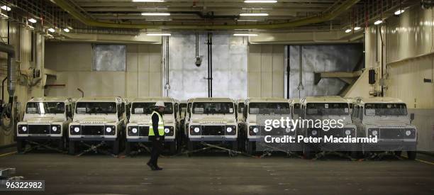 Red Cross Land Rovers line up on the vehicle deck onboard the Royal Fleet Auxiliary supply ship RFA Largs Bay on February 1, 2010 in Southampton,...