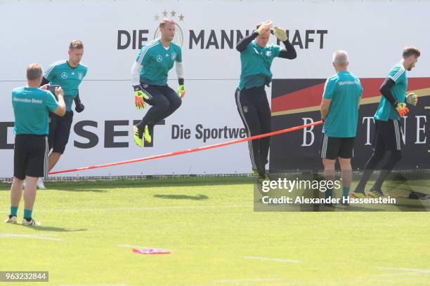 Goalkepper coach Andreas Koepcke takes pictures of Bernd Leno, Manuel Neuer and Marc-Andre ter-Stegen and Kevin Trapp during a training session of...