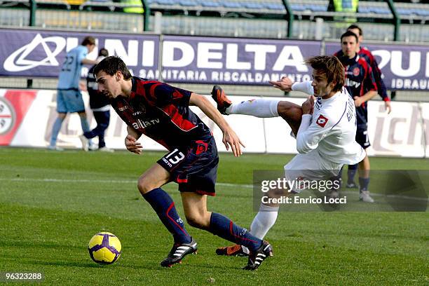 Davide Astori of Cagliari and Alberto Gilardino of ACF Fiorentina during the Serie A match between Cagliari and Fiorentina at Stadio Sant'Elia on...