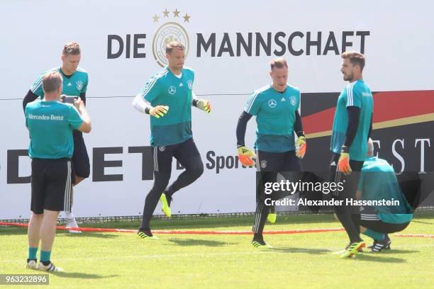 Goalkepper coach Andreas Koepcke takes pictures of Bernd Leno, Manuel Neuer Marc-Andre ter-Stegen and Kevin Trapp during a training session of the...