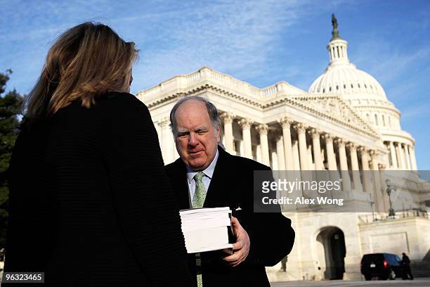 House Budget Committee Chairman Rep. John Spratt receives copies of the FY2011 budget proposal from Legislative Aide of White House Office of...