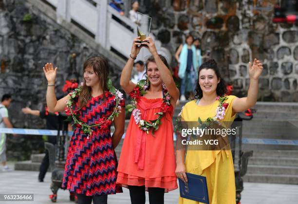 Slackliner Faith Dickey, French slackliner Mimi Guesdon and Canadian slackliner Mia Noblet accept awards after the 'Tianmen Mountain Female...