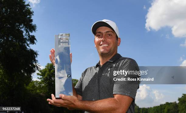 Francesco Molinari of Italy with the winners trophy on the 18th green after the final round of the BMW PGA Championship at Wentworth on May 27, 2018...