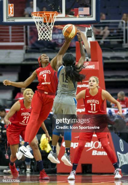 Washington Mystics guard Ariel Atkins blocks a shot attempt by Minnesota Lynx guard Alexis Jones during a WNBA game between the Washington Mystics...