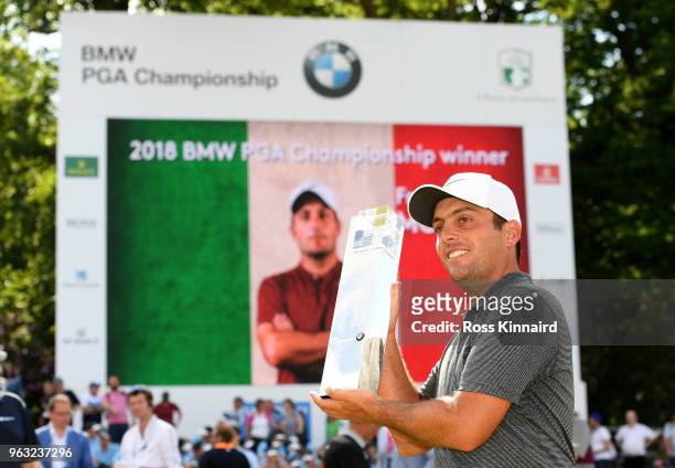 Francesco Molinari of Italy with the winners trophy on the 18th green after the final round of the BMW PGA Championship at Wentworth on May 27, 2018...